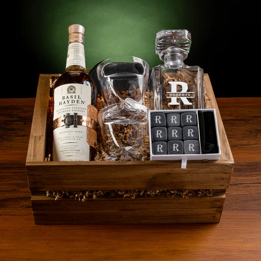 Personalized whiskey gift set with engraved decanter, cigar holder glasses, whiskey stones, and slate coasters in a wooden gift box.