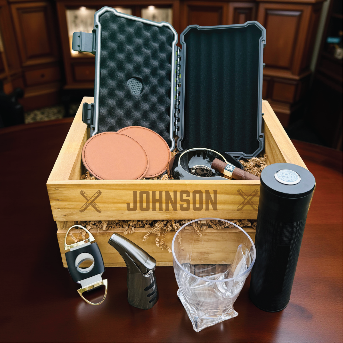 Ultimate personalized cigar gift set with engraved wooden crate, whiskey glass with cigar holder, and humidor for groomsmen.